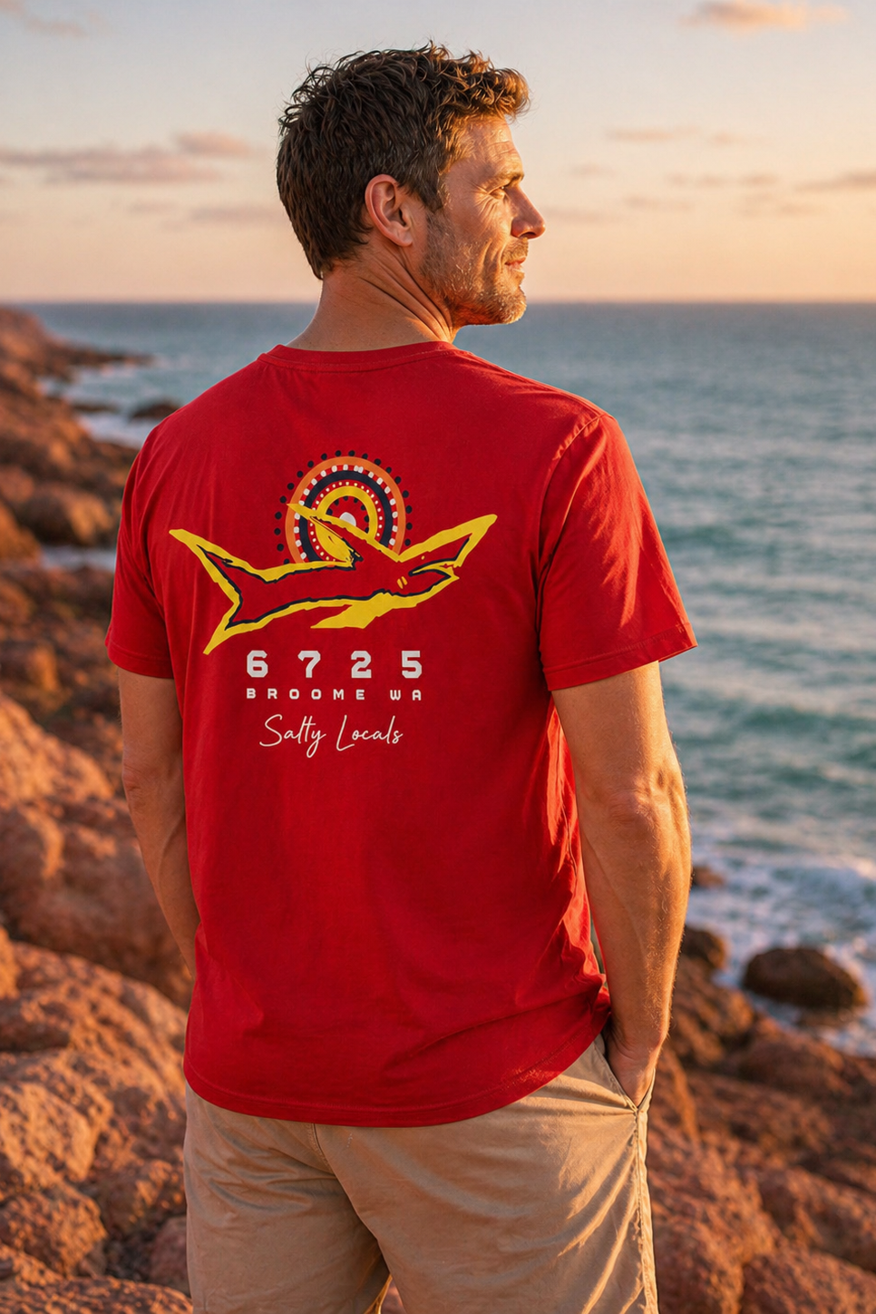 Men's "Salty Locals" Shark T-Shirt - Red | 6725 Broome, showcasing a bold shark graphic against the ocean sunset.